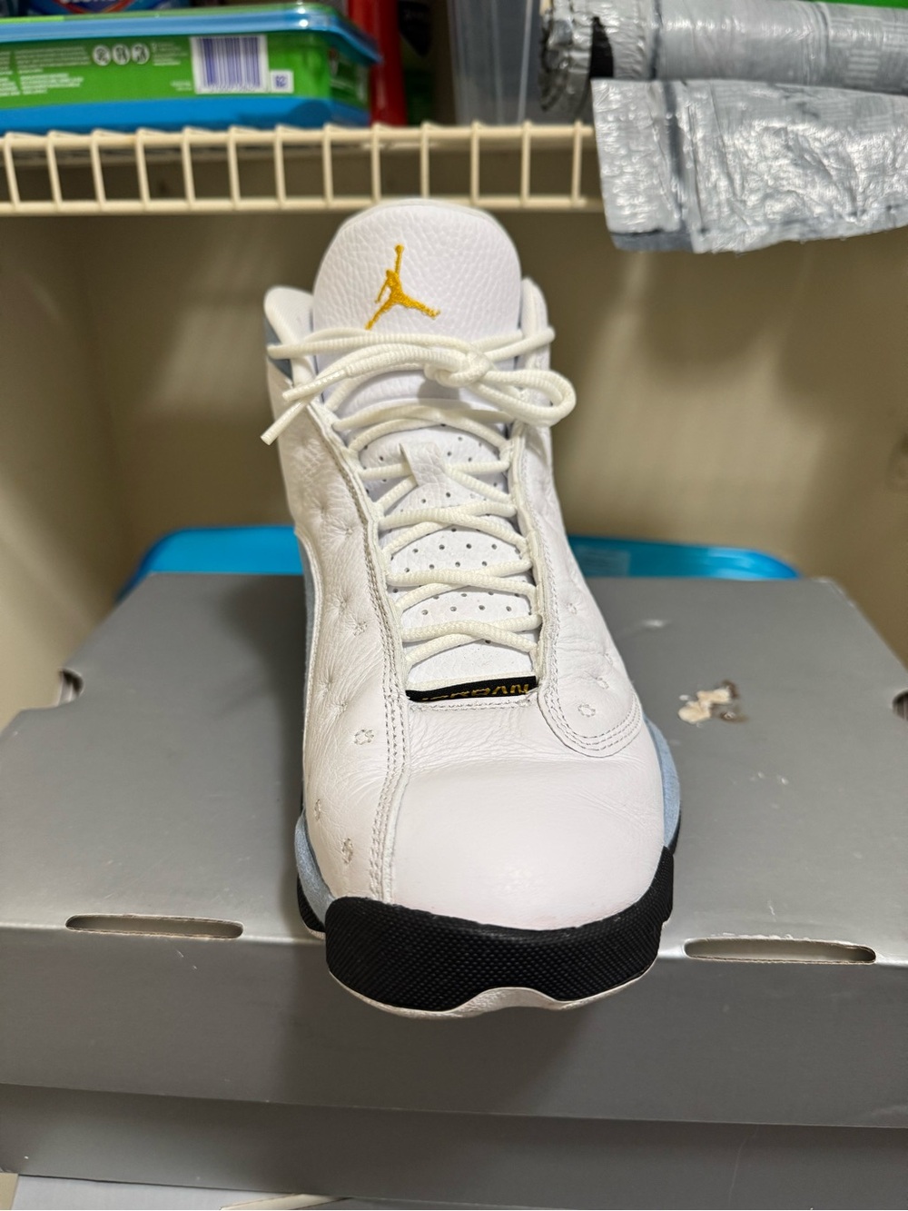 Jordan Men’s White Athletic Shoes with Black and Gold Accents